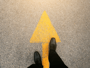 Arrow on a road pointing forward