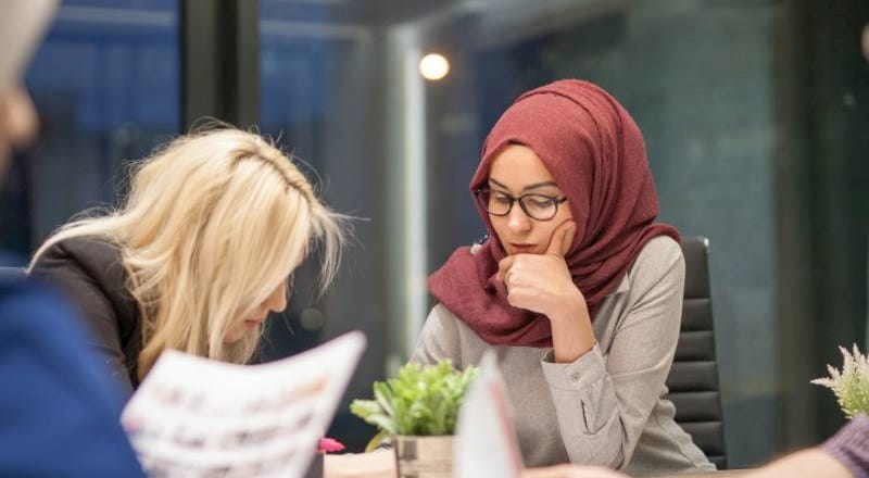 Young Muslim woman at a team meeting