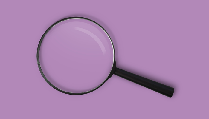 Magnifying glass on a purple background