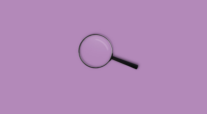 Magnifying glass on a purple background