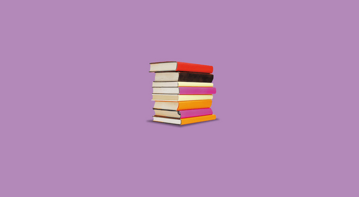 Stack of books on a purple background