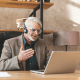 Older man working from home in meeting