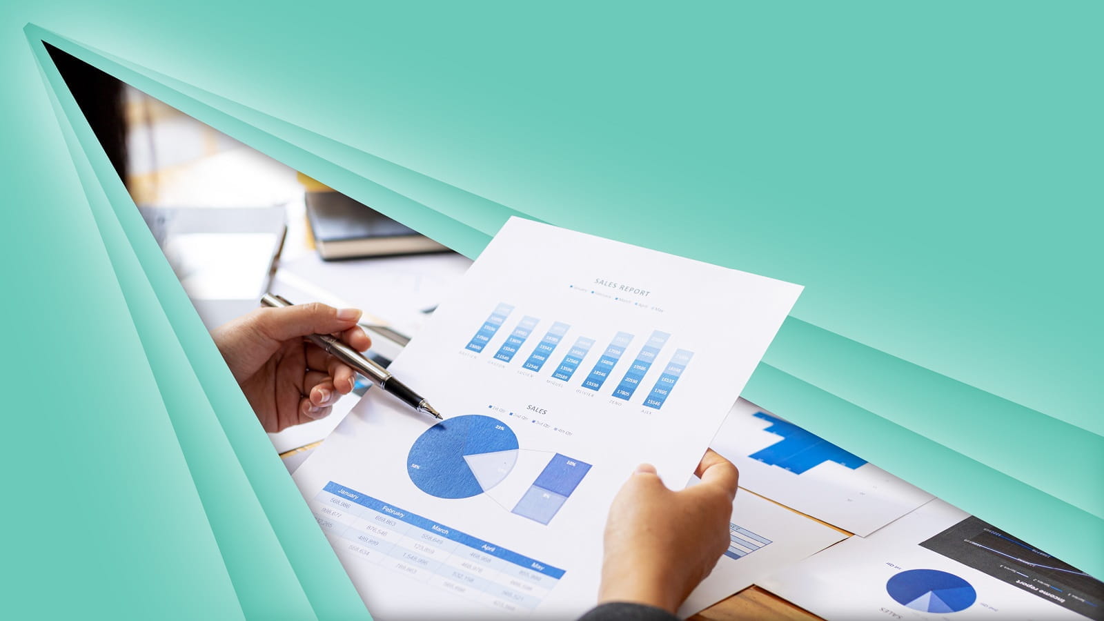 A person holding a sales report  and pen against a green background