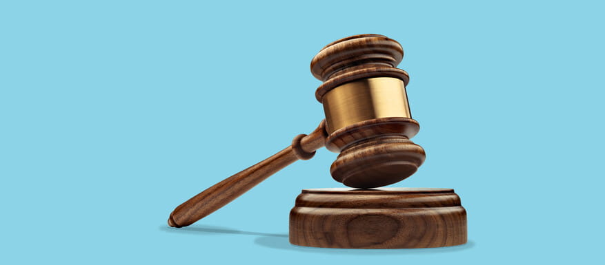 Gavel on a blue background