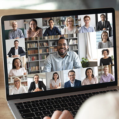 An online conference call taking place on a laptop