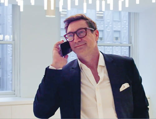 Photo of Shaun Taylor taking a call on a mobile phone