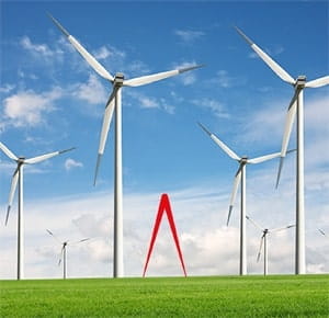 Several large wind turbines standing on a green grassy field under a bright blue sky with scattered white clouds, representing renewable energy and sustainability.