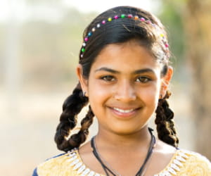 Young smiling girl in yellow top