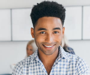 Young professional man smiling at camera