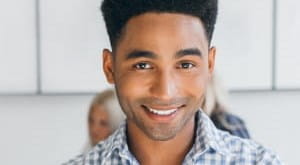 Young professional man smiling at camera