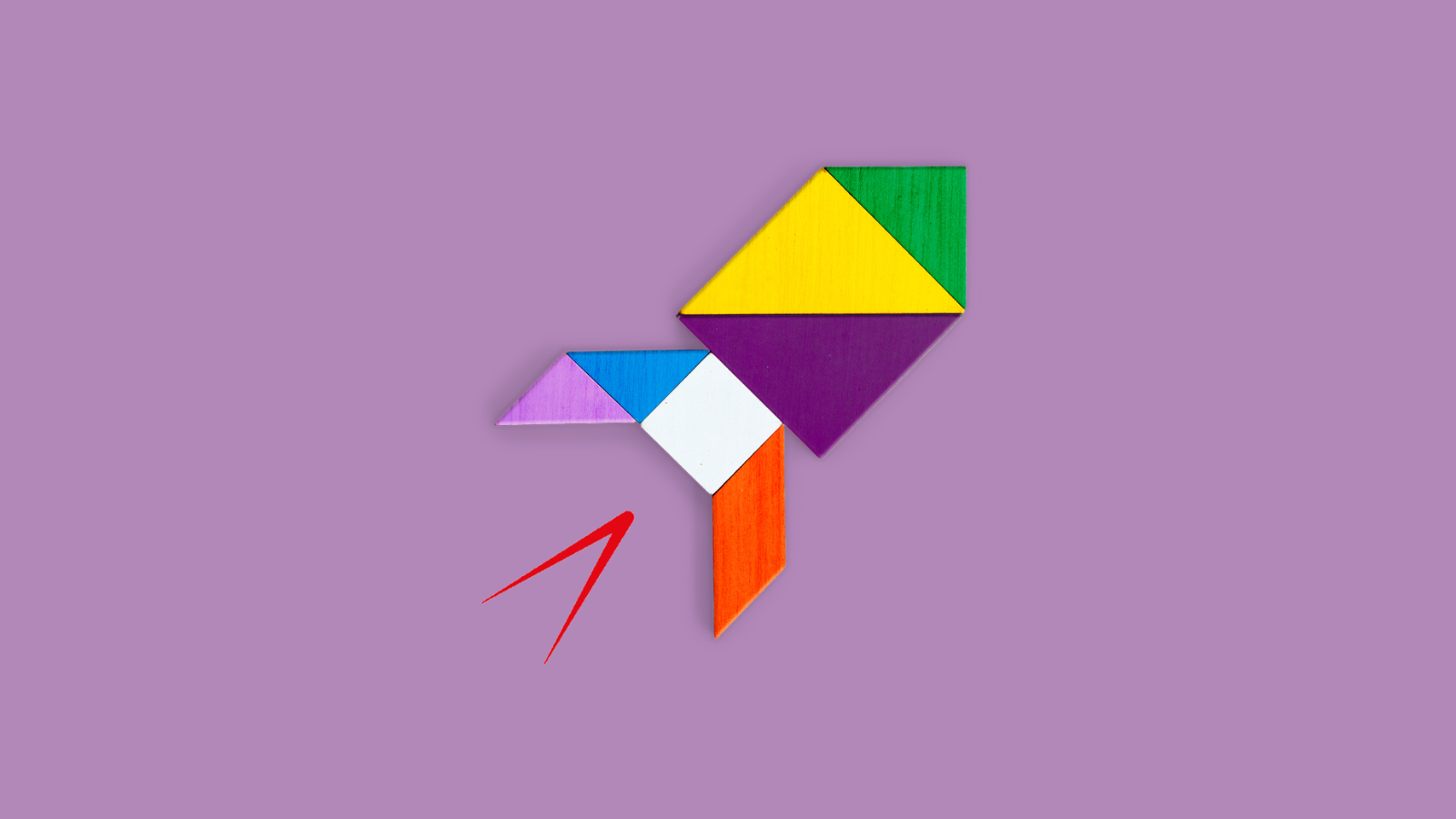 Multicoloured origami rocket on a purple background