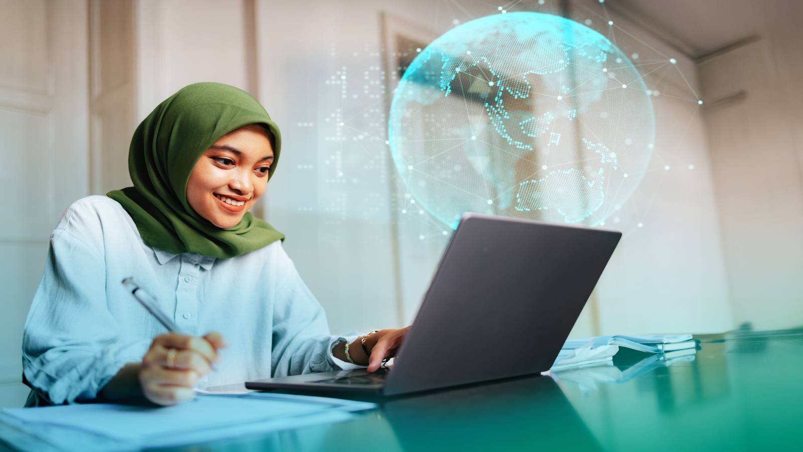 Woman on laptop studying.