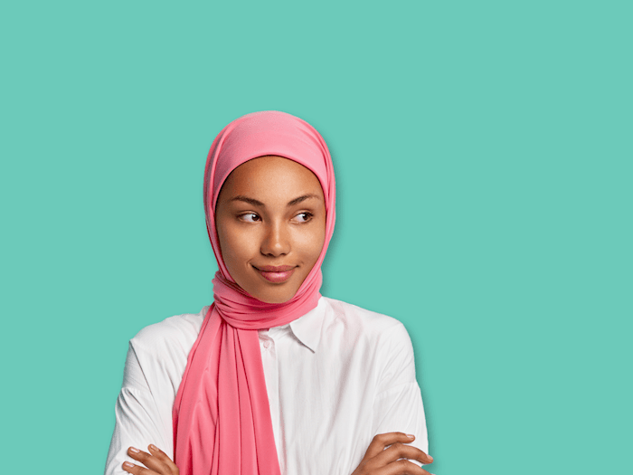 Young woman wearing a pink headscarf