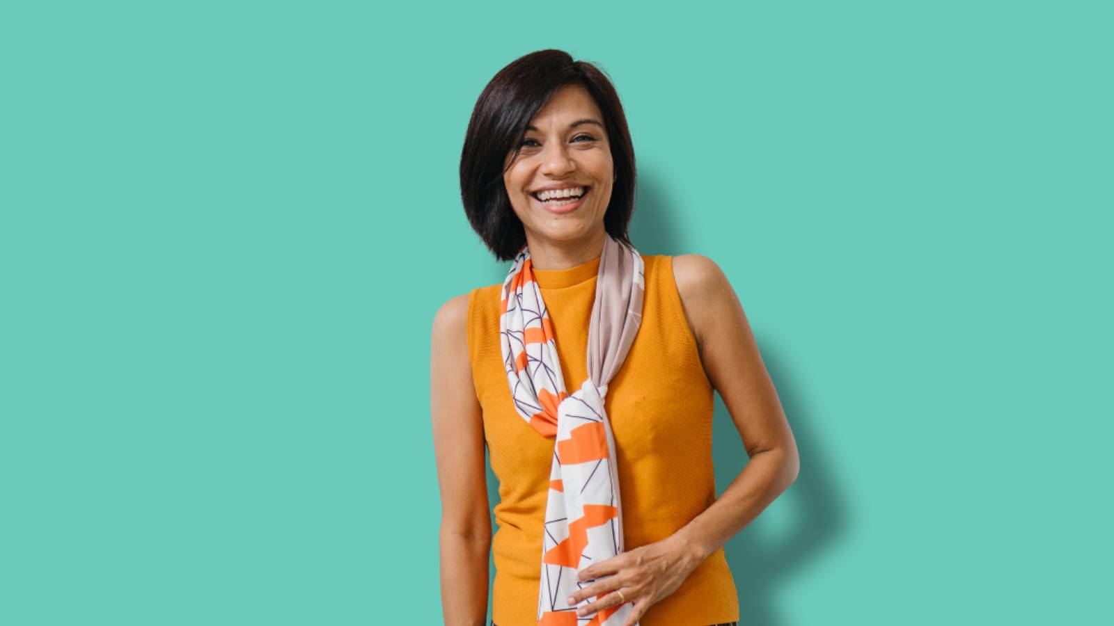Women in orange top and scarf