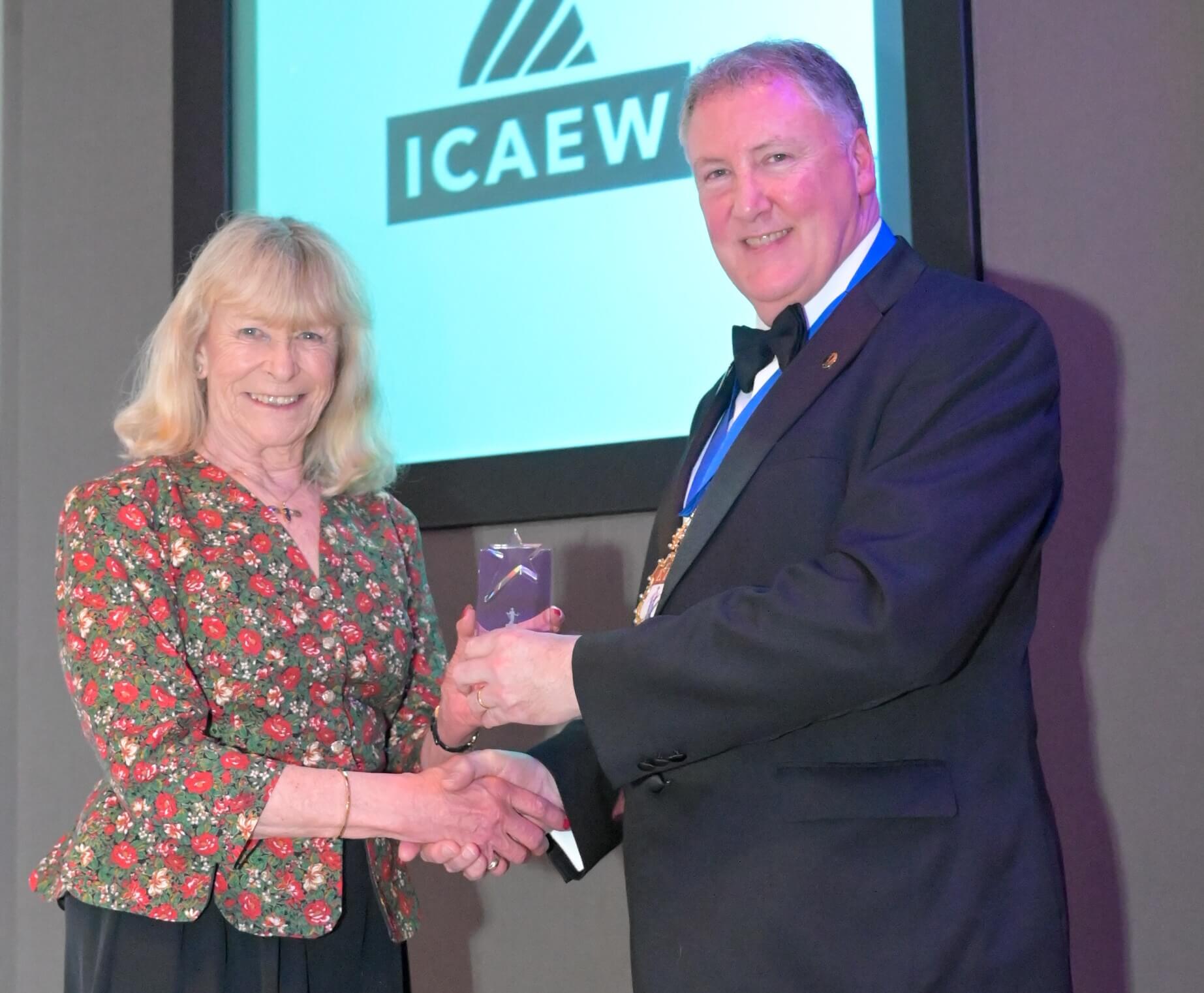 Evie Bowyer, FCA, receiving a 2026 ICAEW Volunteering Award, from Derek Blair, ICAEW President 2025-26.