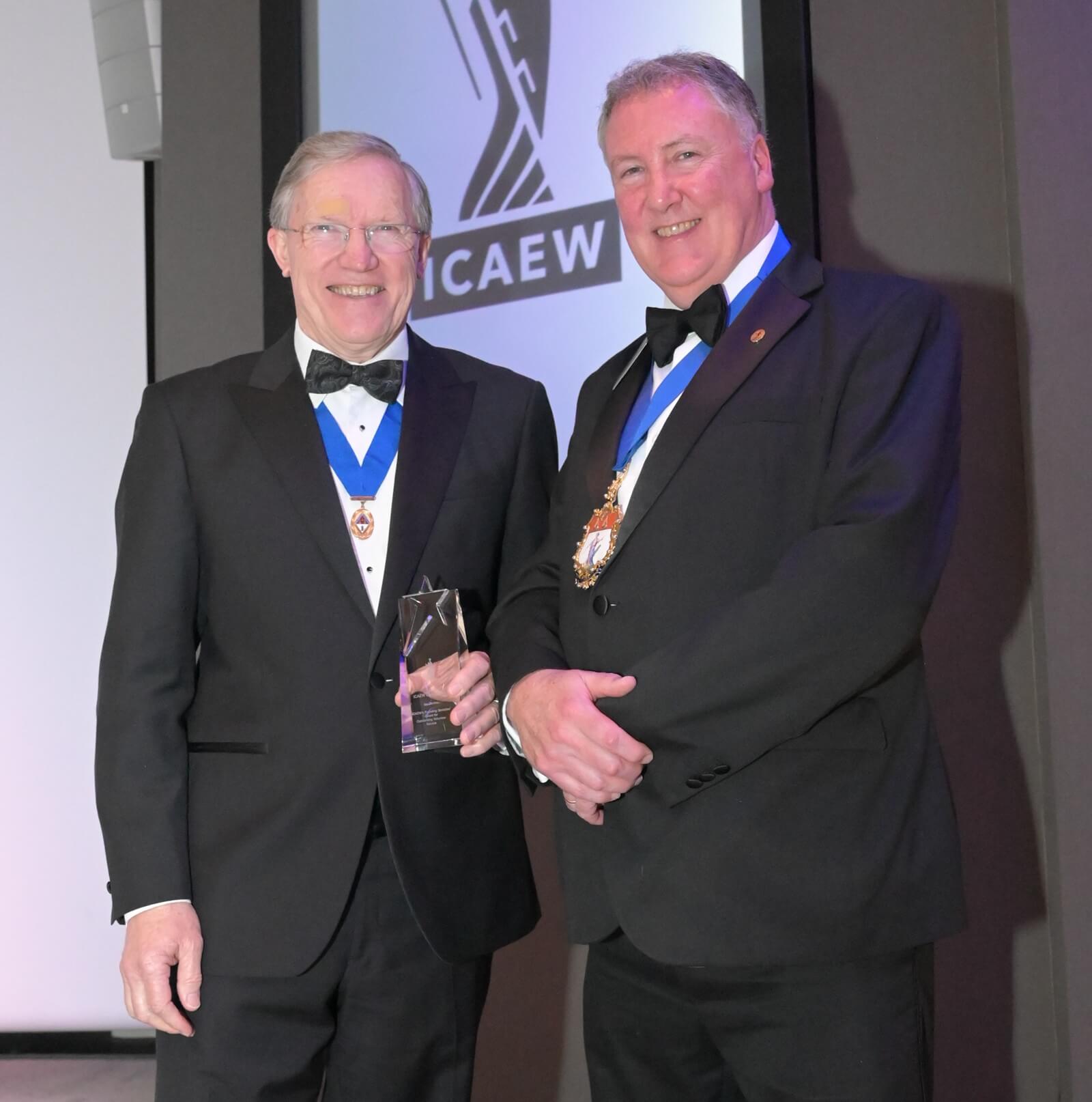 Ian Davies, MBA FCA, receiving a 2026 ICAEW Volunteering Award, from Derek Blair, ICAEW President 2025-26.