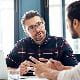 Two men having a discussion at work