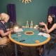 Polly Tsang and Philippa Lamb around a table in a podcast studio