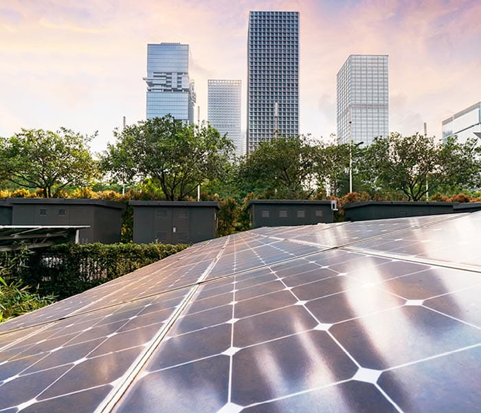 Solar panels, greenery and skyscrapers