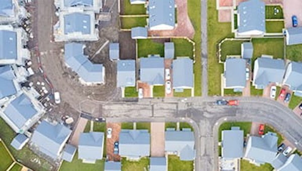 Aerial view of suburban residential streets in summer.