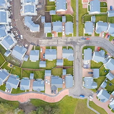 Aerial view of suburban residential streets in summer.