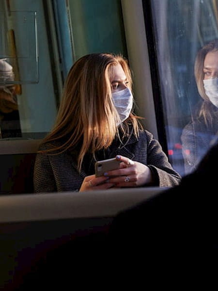 Coach passengers wearing facemasks