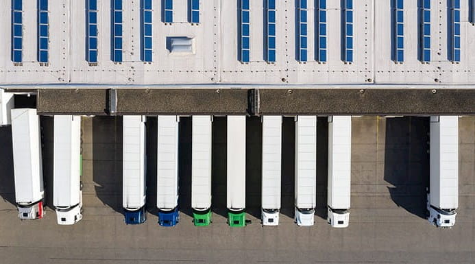 Aerial view of lorries loading at logistics centre
