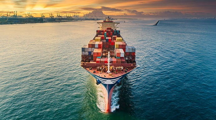 Front view of a container ship at sea