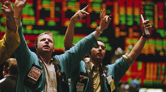Traders waving arms on Exchange floor