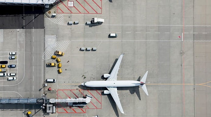 A plane in an airport, seen from above