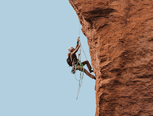 Person climbing a rock face