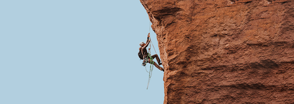 Person climbing a rock face