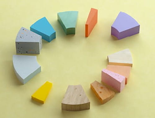 Coloured wooden blocks representing an exploded pie chart