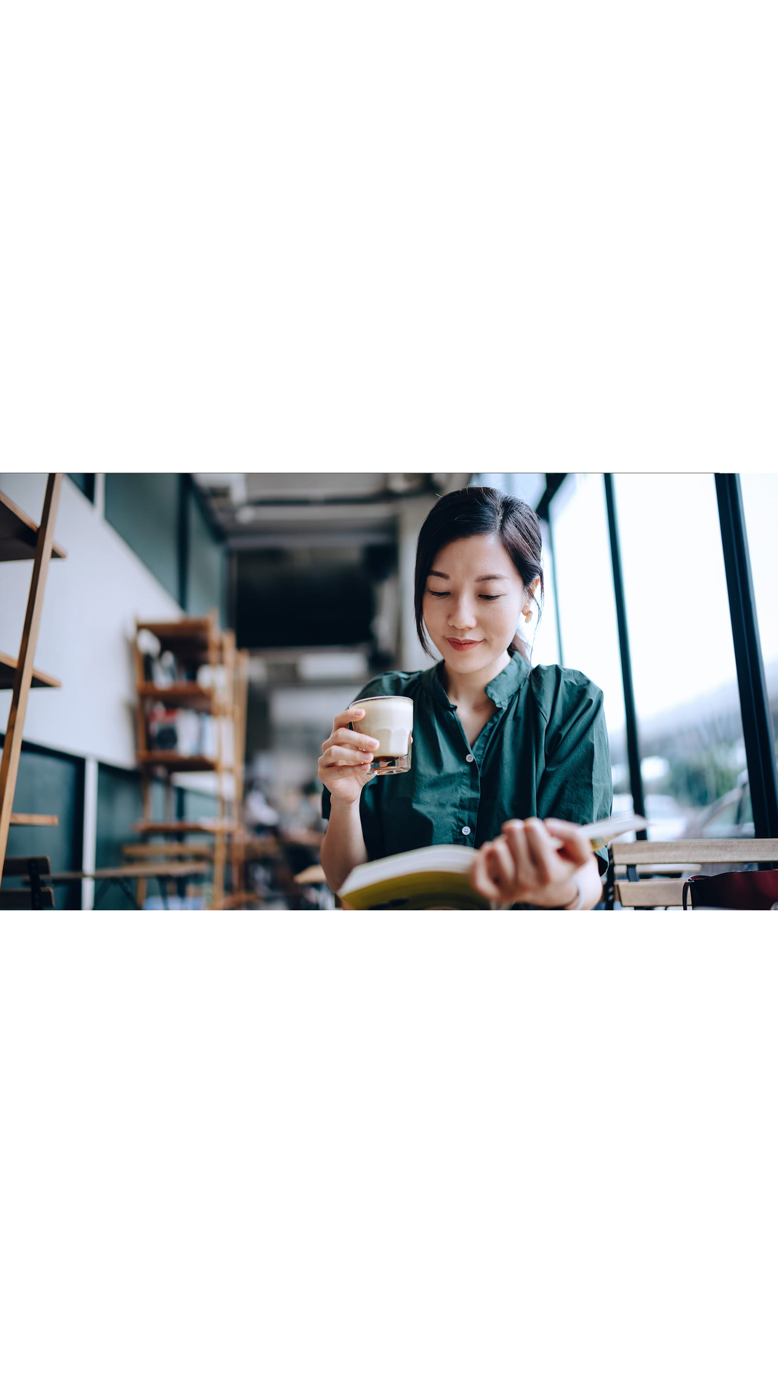 young asian woman green shirt studying book reading office study room cup of coffee