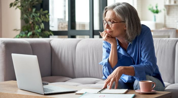 Woman looking at her laptop
