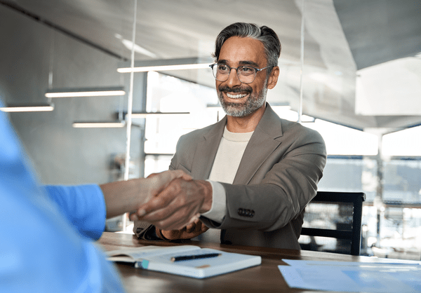 mature businessman shaking hands