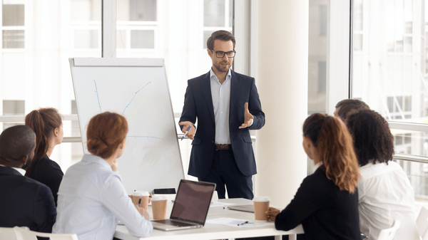 Young male professional presenting in meeting