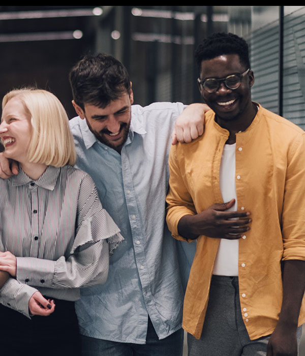 Young people arm-in-arm, smiling