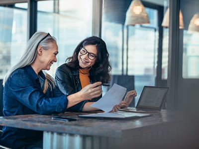Two people at a laptop