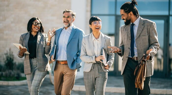 Office workers walking together in the street