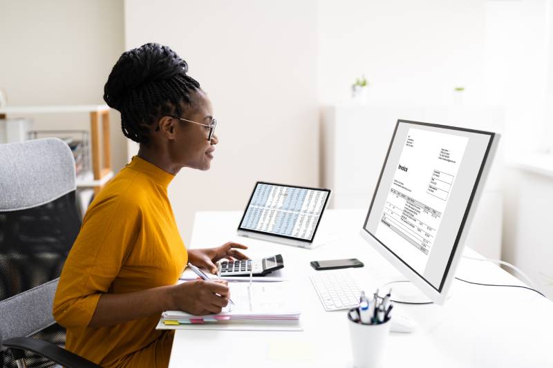 Woman sitting in front of computer