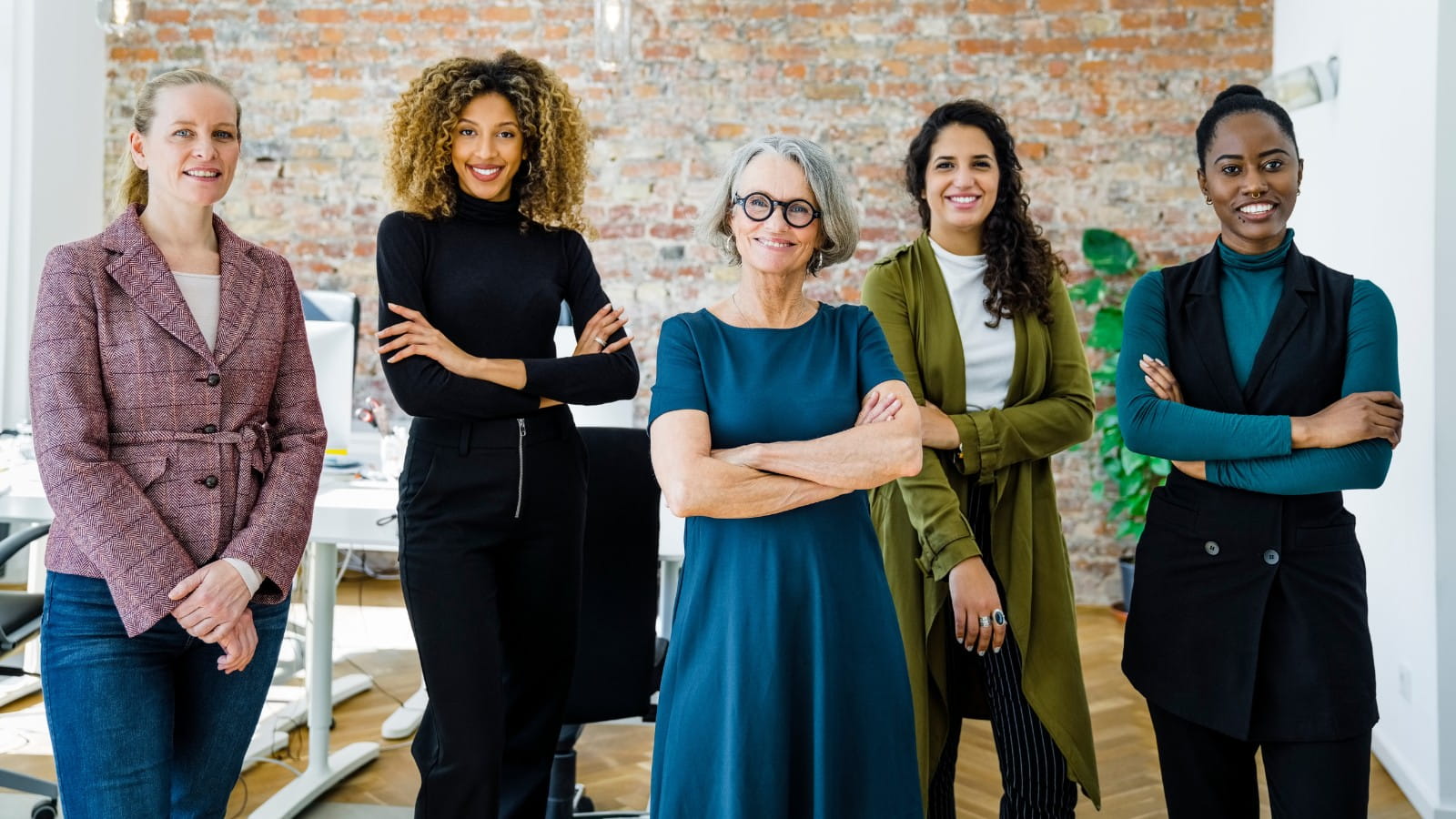 Image of five professional women standing in a row