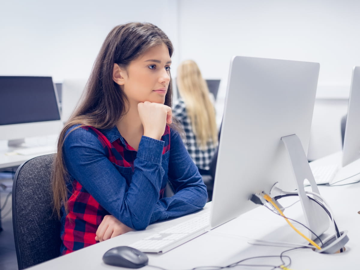 Young female sitting at computer