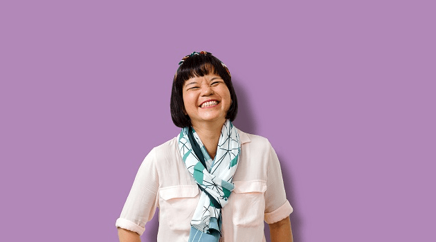 Smiling woman wearing teal scarf