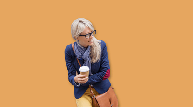 Woman with satchel holding coffee cup