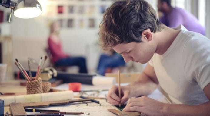 Young man drawing