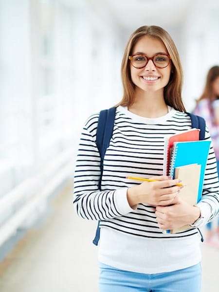 Young female student with notebooks