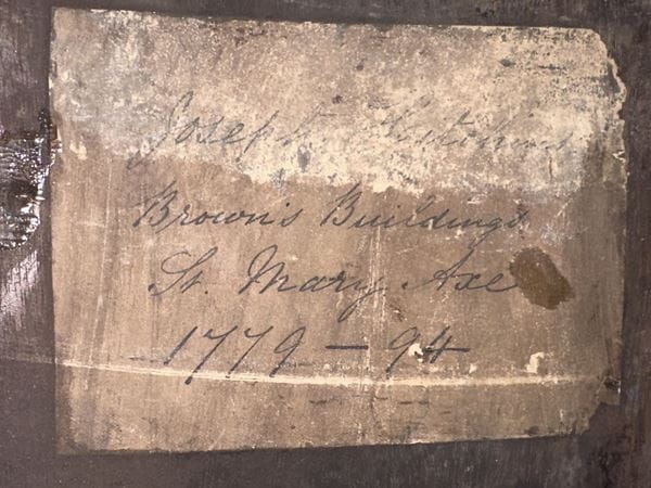 Photograph showing a note which is affixed to the inside of ICAEW’s Act of Parliament clock. It reads "Joseph Hitchin, Brown's Buildings, St. Mary Axe, 1779-94".