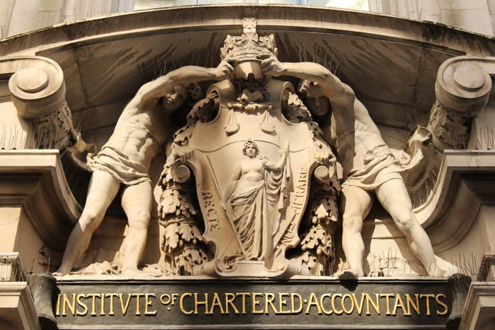 Photograph showing the stone sculpture of the ICAEW coat of arms which sits above the main entrance to Chartered Accountants' Hall.