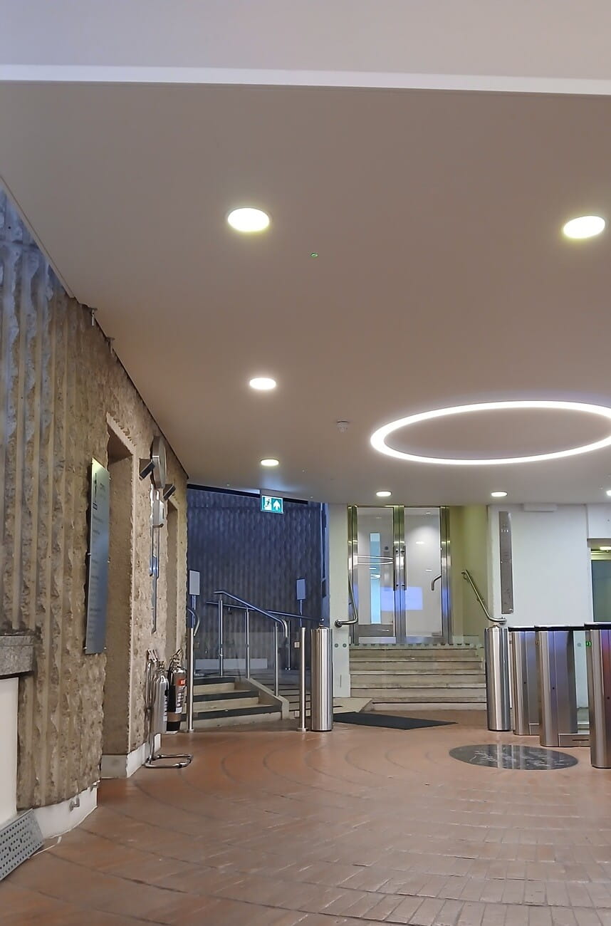 a cluttered entrance lobby in a modern building